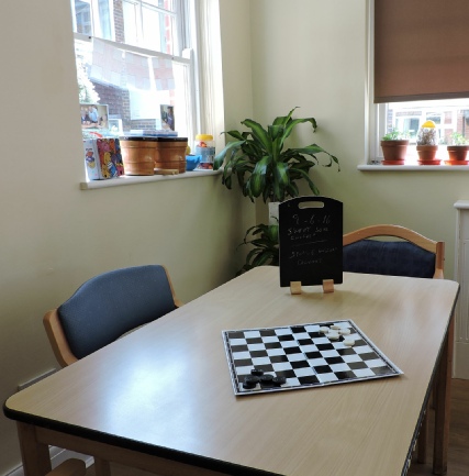 Chessboard on table showing activities in Care Home